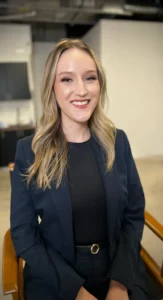 Corporate Office Makeup by Waring Makeup - Ottawa Executive Makeup Smiling woman in a navy suit with professional corporate makeup, styled by Waring Makeup, Ottawa Office Makeup Services.