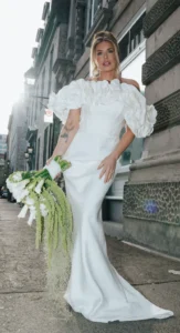 Modern bride walking outdoors in a sleek white gown with bold makeup by Waring Makeup, Ottawa Wedding Makeup Artist.